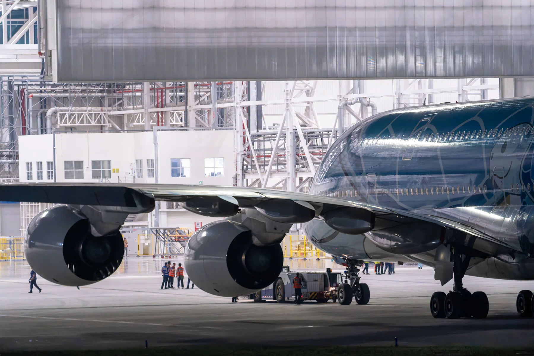 Commercial aircraft inside an aviation maintenance hangar